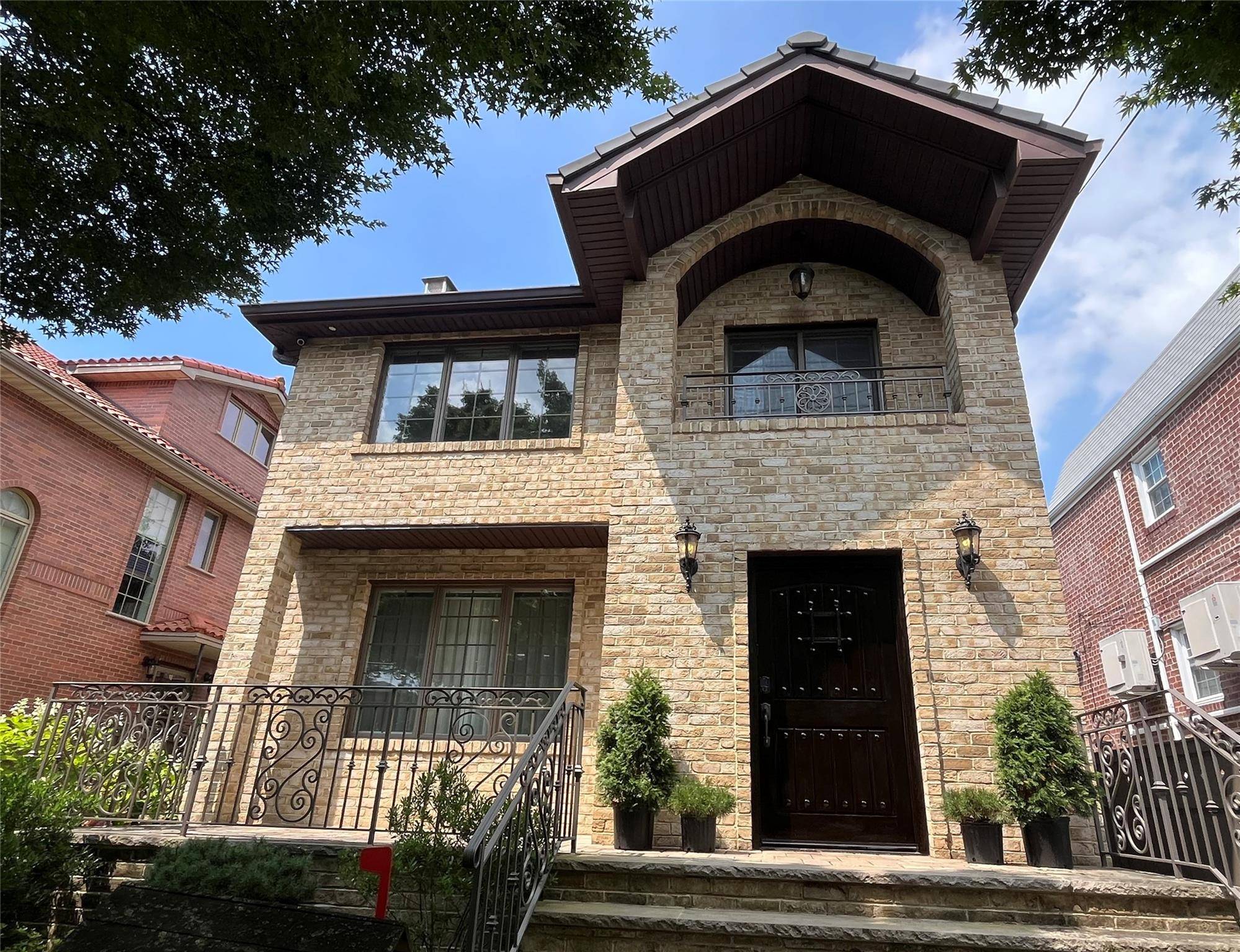 Welcome to this Exquisitely Designed Two Family Home This beautifully appointed two family residence masterfully blends timeless elegance with modern functionality.