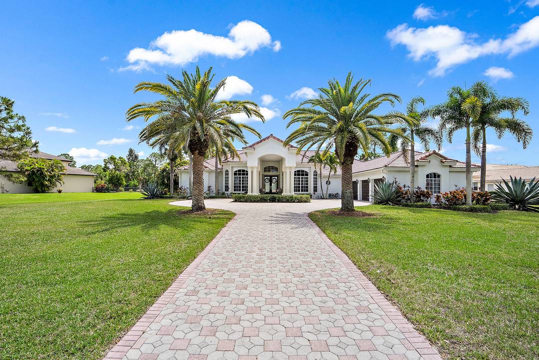 Welcome to your own 1. 05 ACRE ESTATE located in the sought after Bay Hill Estates neighborhood of Palm Beach Gardens.