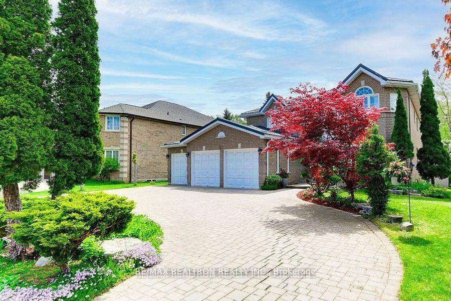 Custom Built Chiavatti Home, with a Triple Garage and Backing onto Ravine.