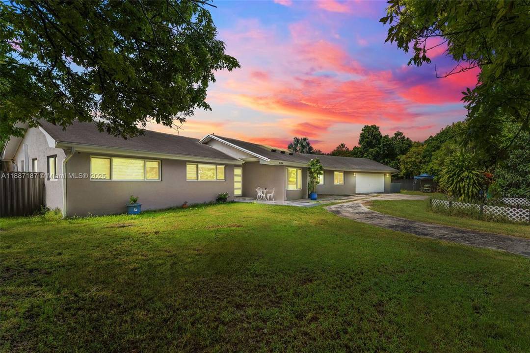 Beautifully remodeled home featuring brand new floors, a modern bathroom, and a spacious open kitchen, perfect for family gatherings.