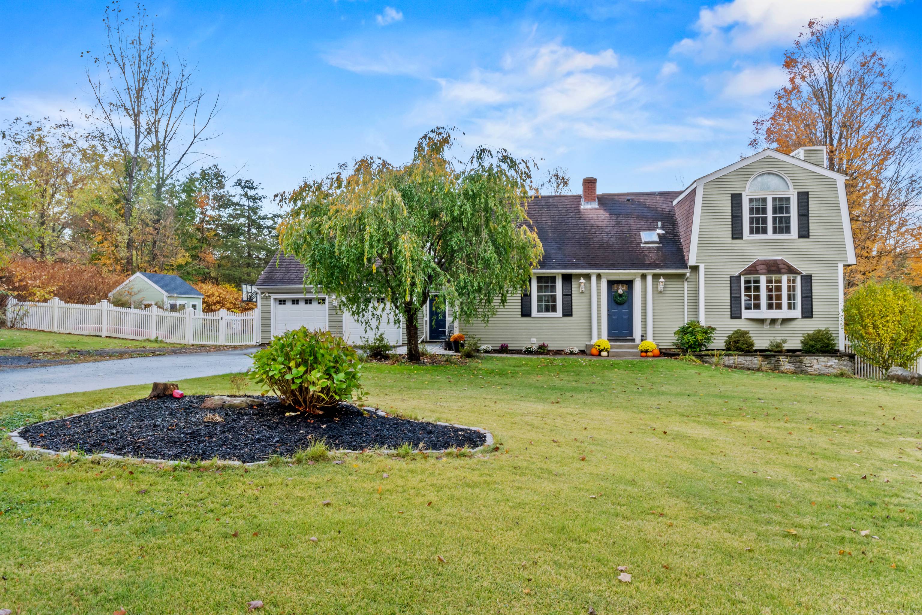 Welcome to 781 Cook Hill Road, where classic charm meets modern updates on a private, nearly 2 acre level lot.