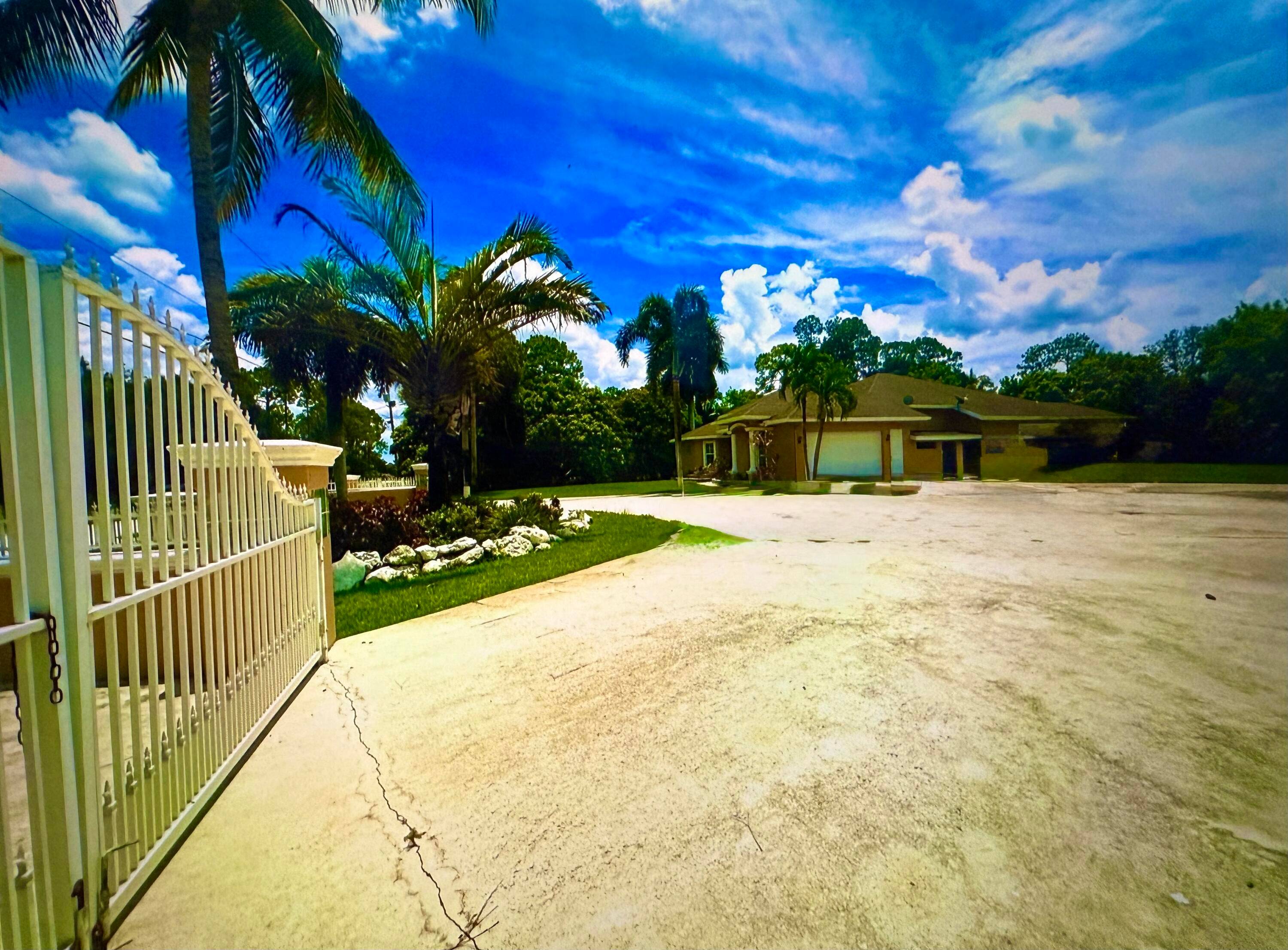 1. 15 ACRES. CBS. NO HOA BRING THE RV, BOAT, TRAILER, TOYS AND PETS WELL MAINTAINED 5 BEDROOM 3 BATHROOM 2 CAR GARAGE IN DESIRABLE LOXAHATCHEE FULLY FENCED.