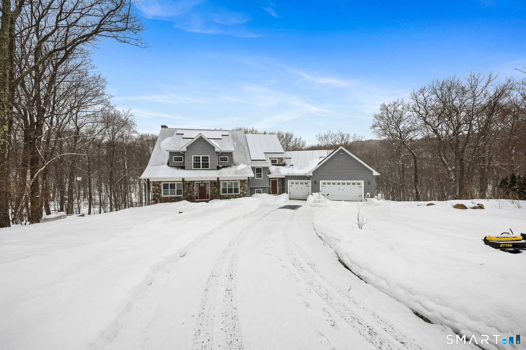 Nestled on 2. 06 acres of total privacy, this exceptional 2018 built home at 14 Laurelwood Drive offers the perfect blend of modern design, custom craftsmanship, and serene surroundings.
