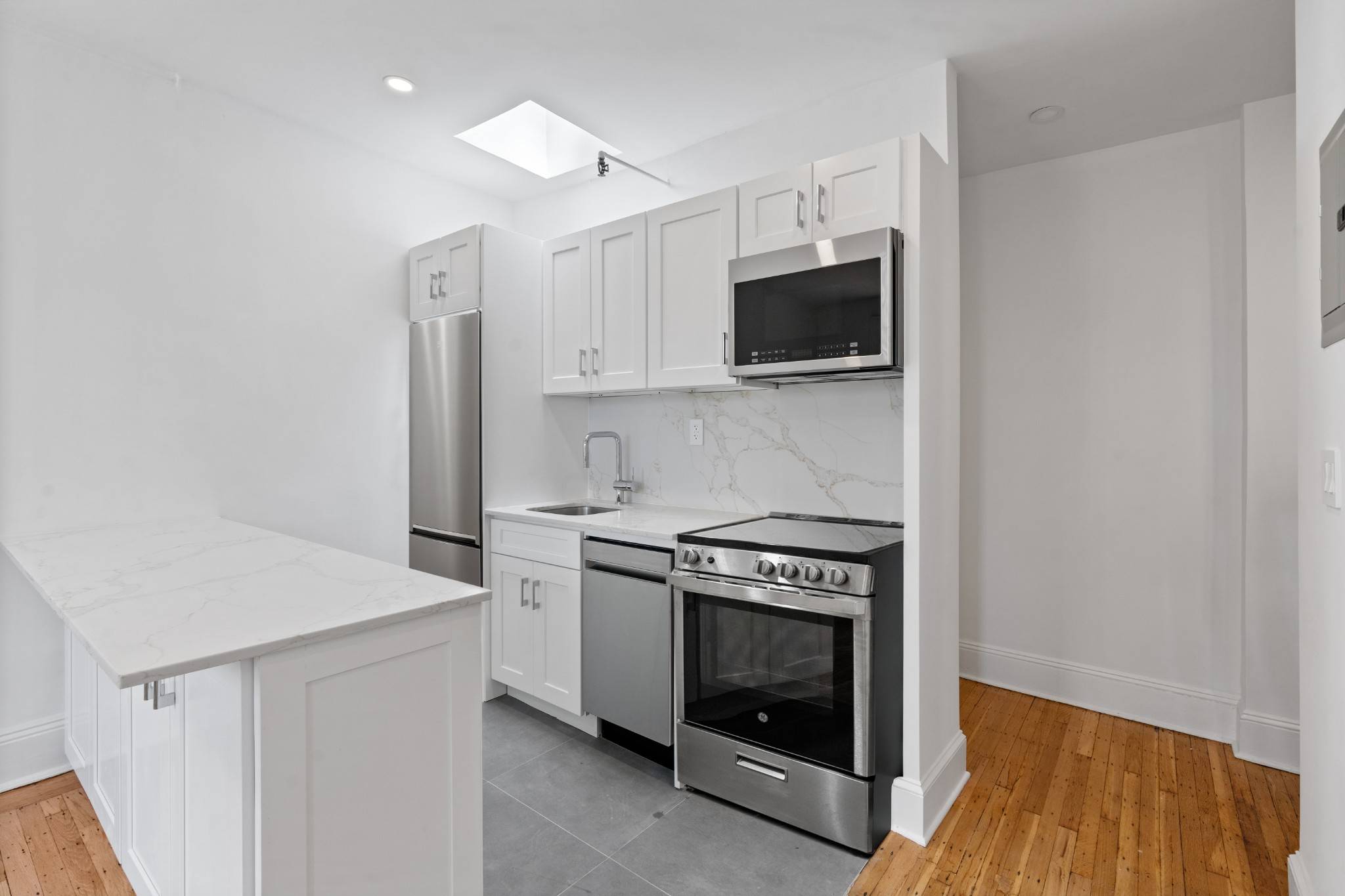 Perched on the fourth floor of a classic walk up townhouse, this spacious one bedroom apartment offers a rare combination of charm, light, and private outdoor space in the heart ...
