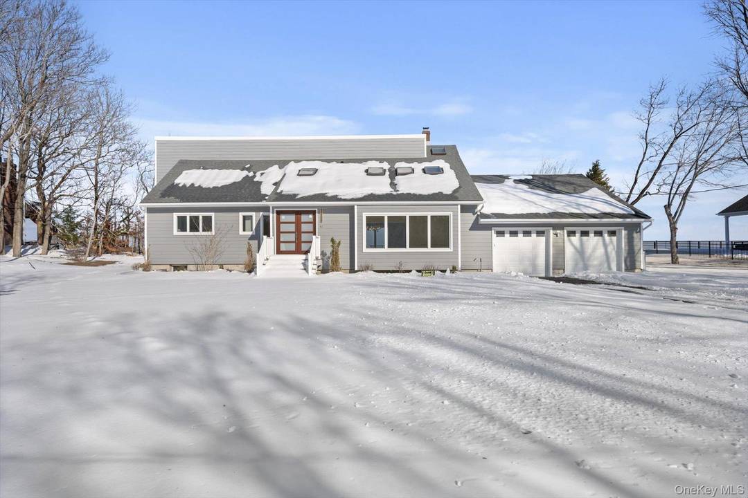 Stunning waterfront residence with breathtaking views from most rooms, located in the private, gated beach community of Scotts Beach.