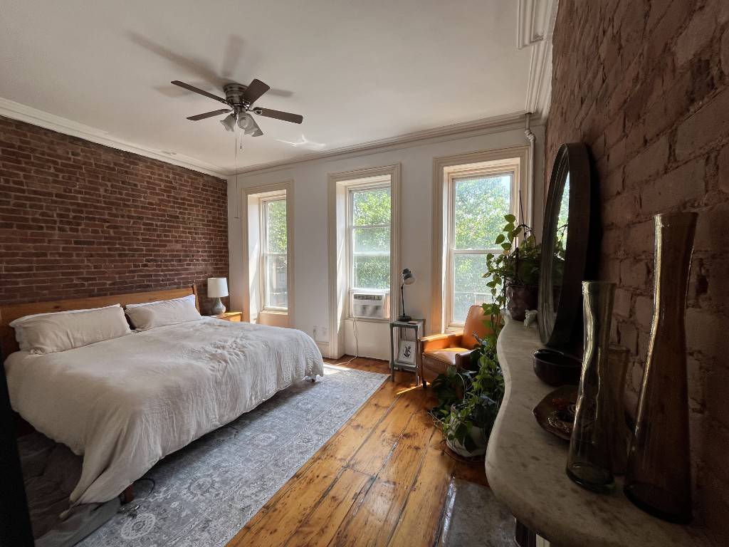 Stunning, floor through 1 Bedroom renovated and restored with all original details including crown and floor molding, pocket doors, exposed brick and 10 ceilings.