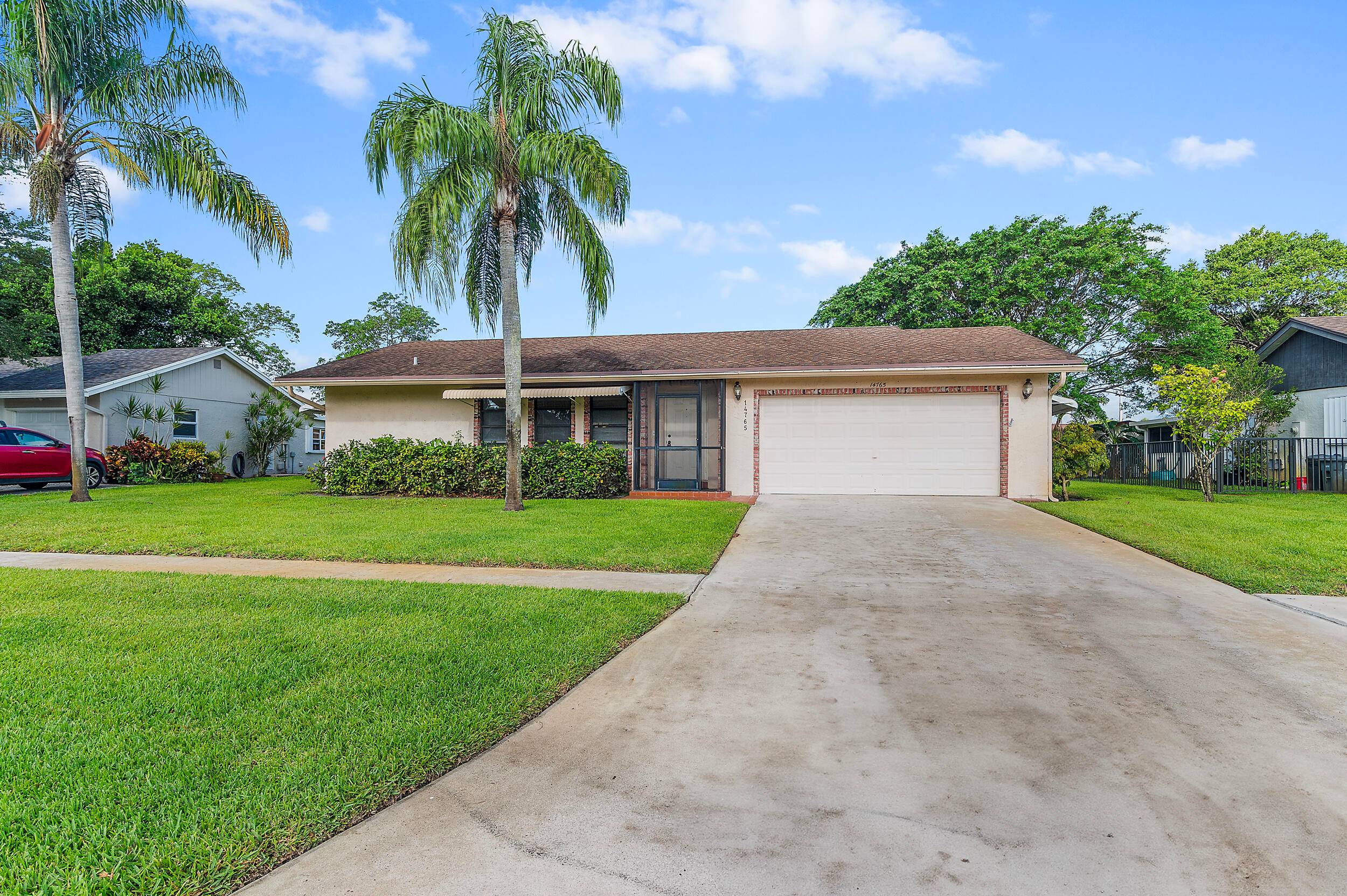 Beautifully maintained home in the sought after 55 active community of Coco Wood Lakes !