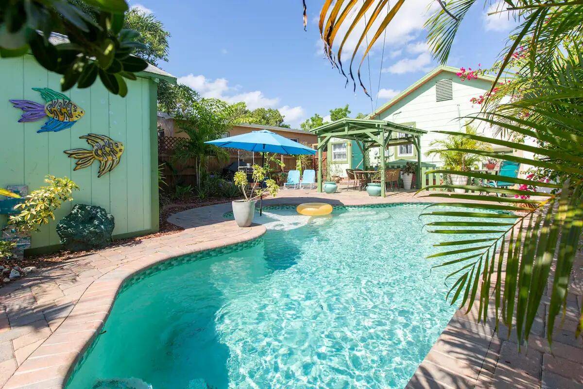 Charming Lake Worth Beach home with detached cottage and saltwater pool in Mango Groves Historic District !