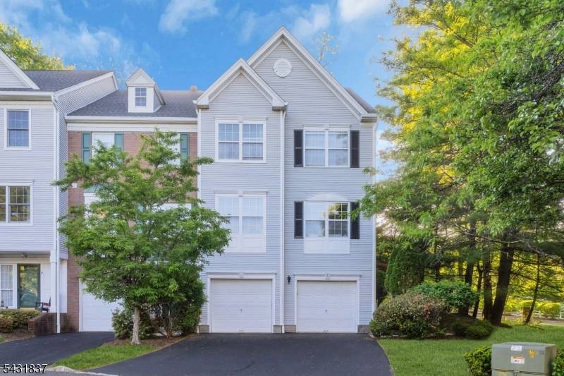 Step into luxury in this impeccably designed townhome offering elegant living spaces, dramatic vaulted ceilings, premium modern finishes and hardwood floors throughout.