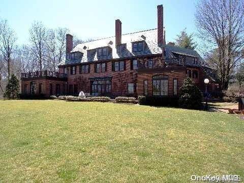 WELCOME HOME TO THIS MAGNIFICENT ESTATE LOCATED AT 219 FEEKS LANE LOCATED IN THE VILLAGE OF MILL NECK ALSO KNOWN AS LION GATE ESTATES.