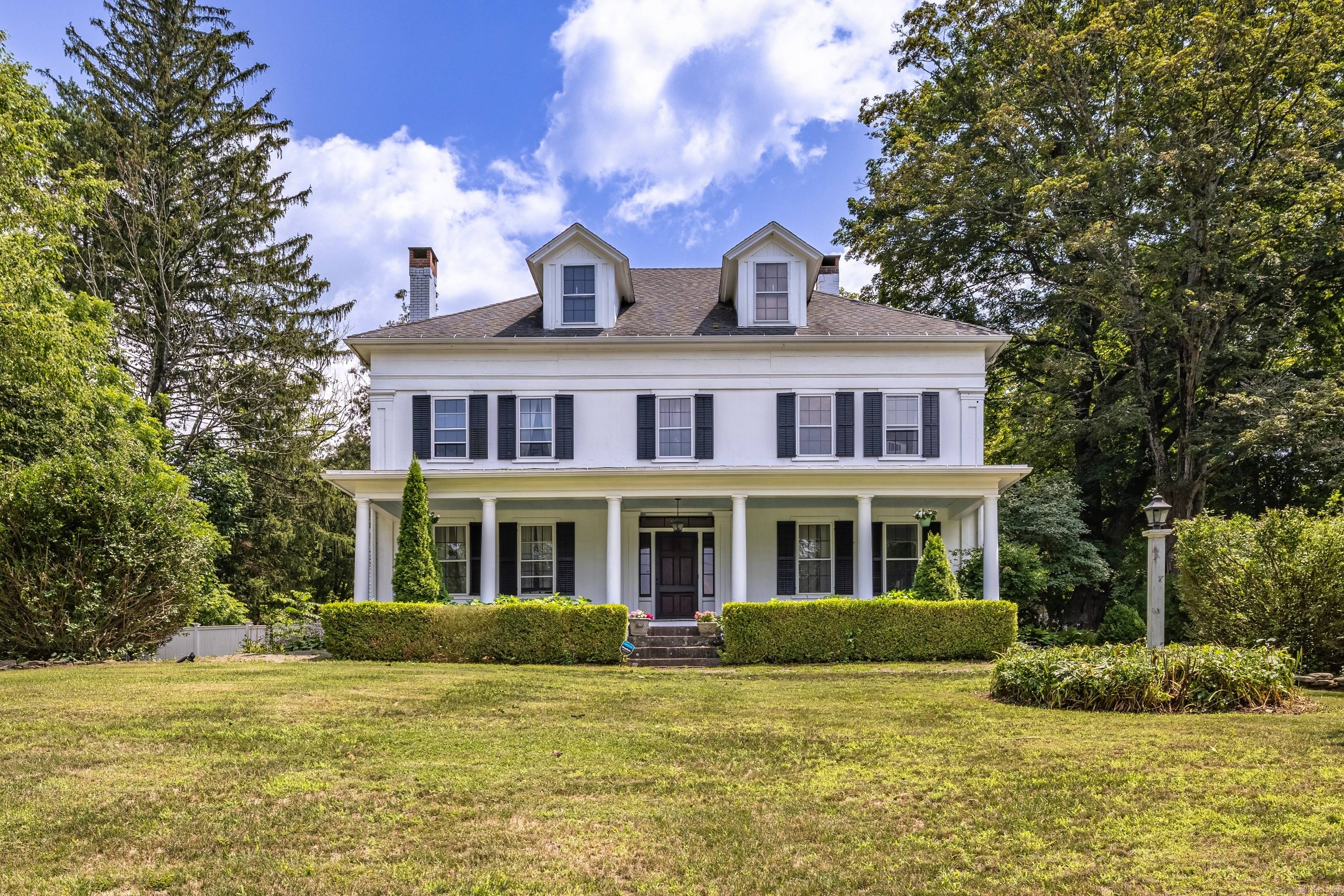 Elegant, Greek Revival Colonial home in historic Windham Center completely remodeled in 2005 by New England Design.