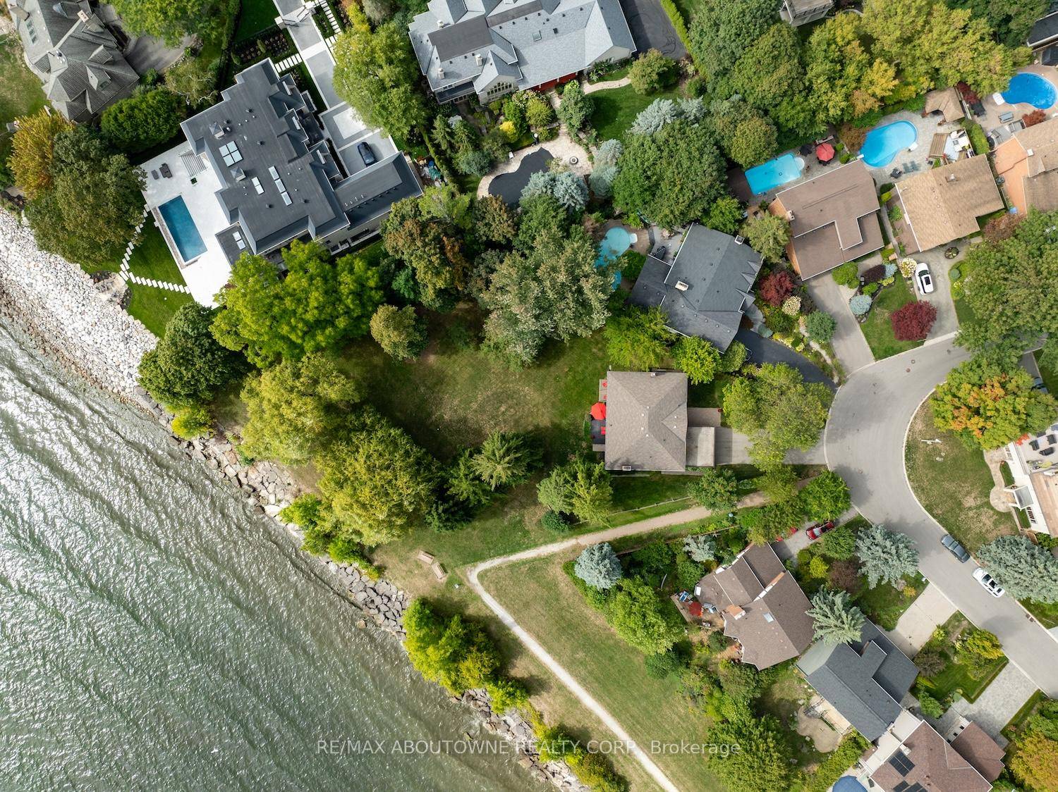 Unobstructed Lake Ontario views define this rare opportunity in South East Oakville's prestigious Arkendo enclave.