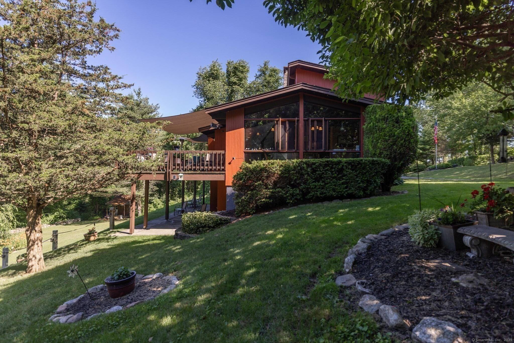 Lakefront Living Oasis A serene retreat tucked away on almost 6 acres of beautiful land and pond, close to the Woodstock, CT.