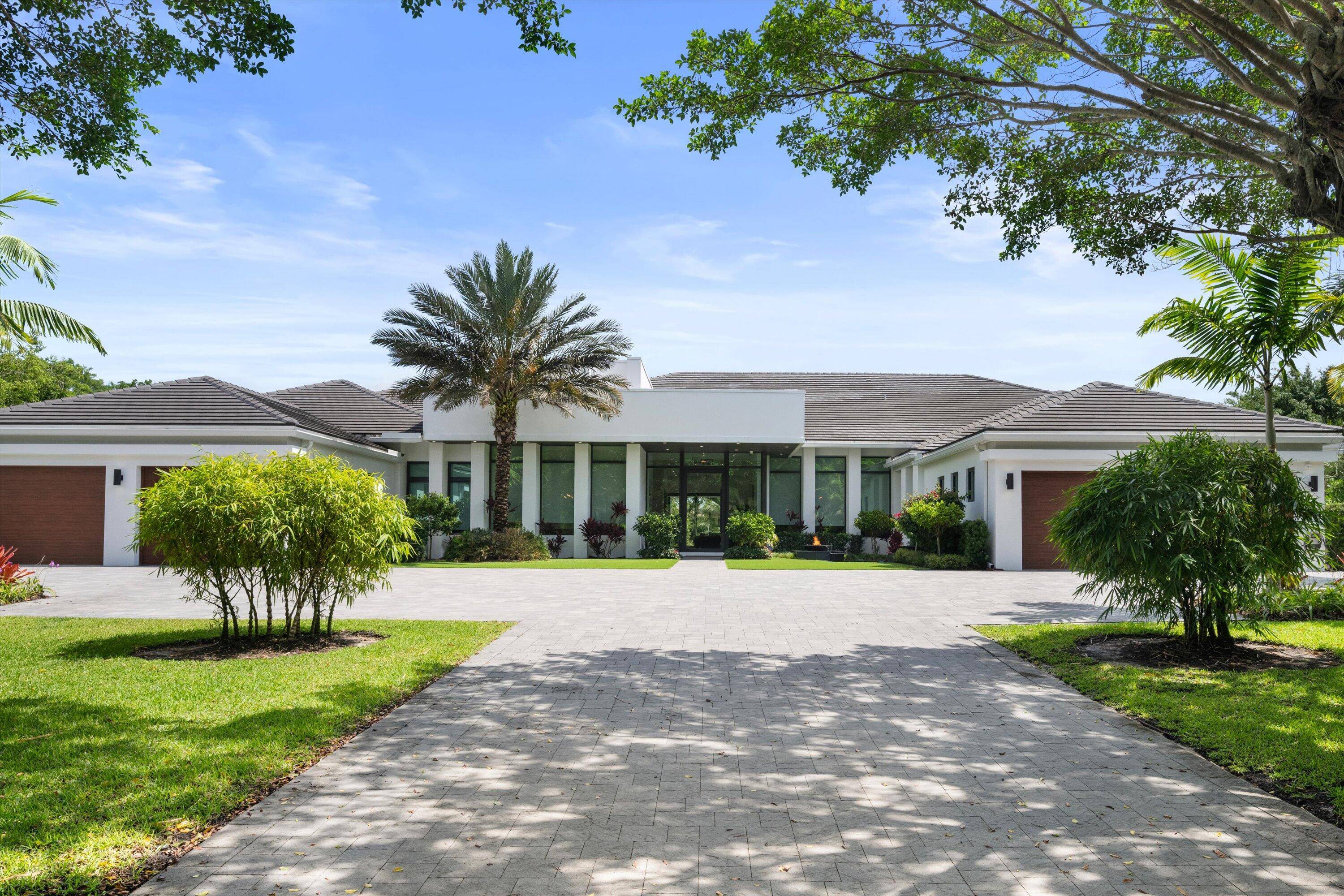 Discover the pinnacle of modern luxury in this stunning 2022 built residence, located within the prestigious gates of Long Lake Estates.