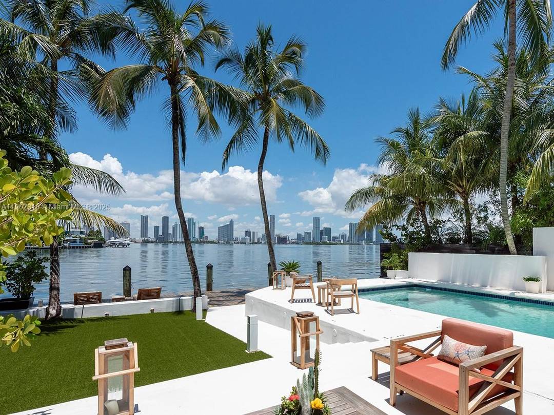 Waterfront oasis with western exposure offering striking views of the Miami skyline, wide open bay, and incredible sunsets year round !