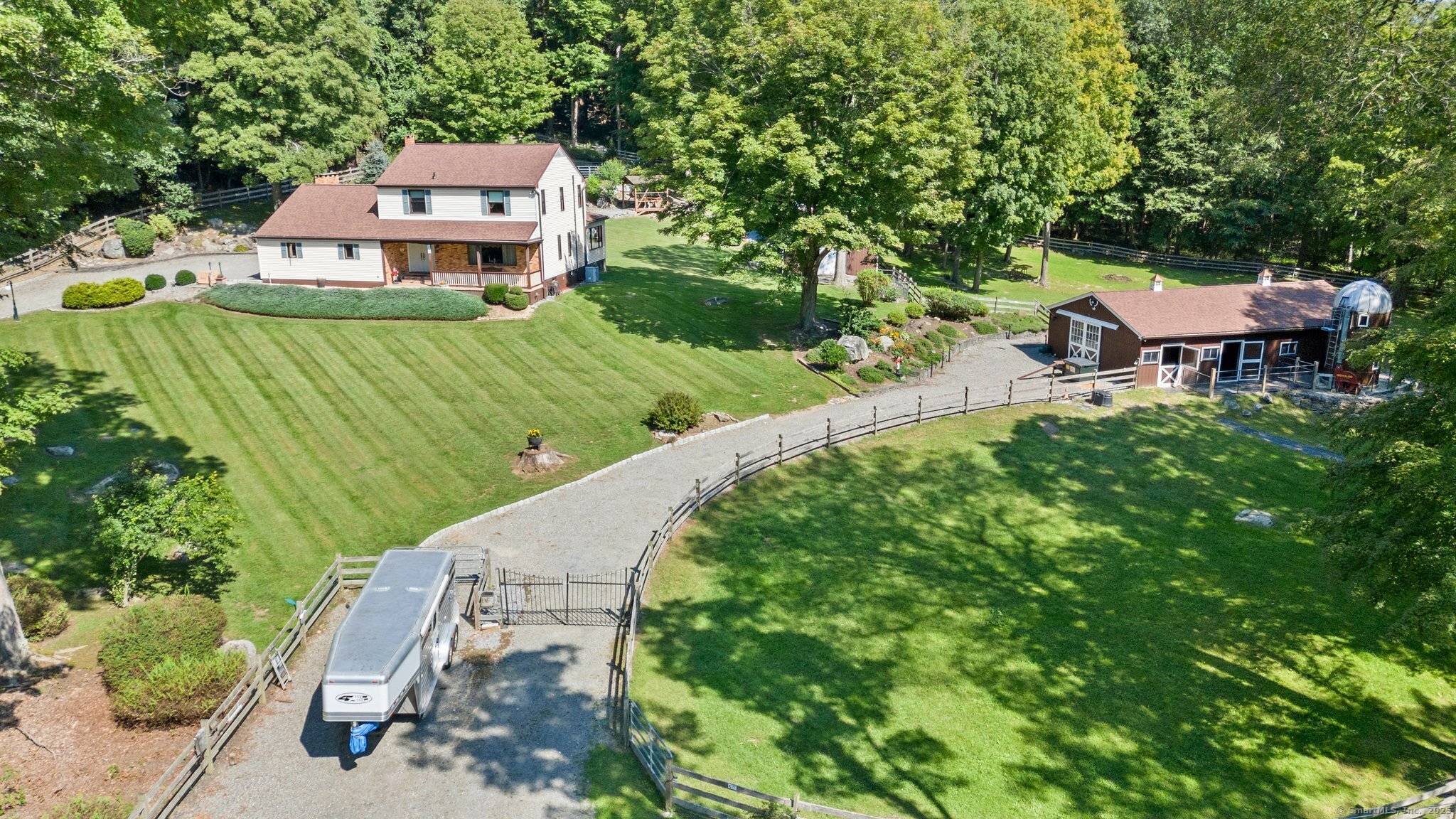 This beautifully maintained four bedroom, two bath Colonial home is a rare find a true turnkey equestrian retreat that seamlessly blends classic architectural charm with high end modern updates.