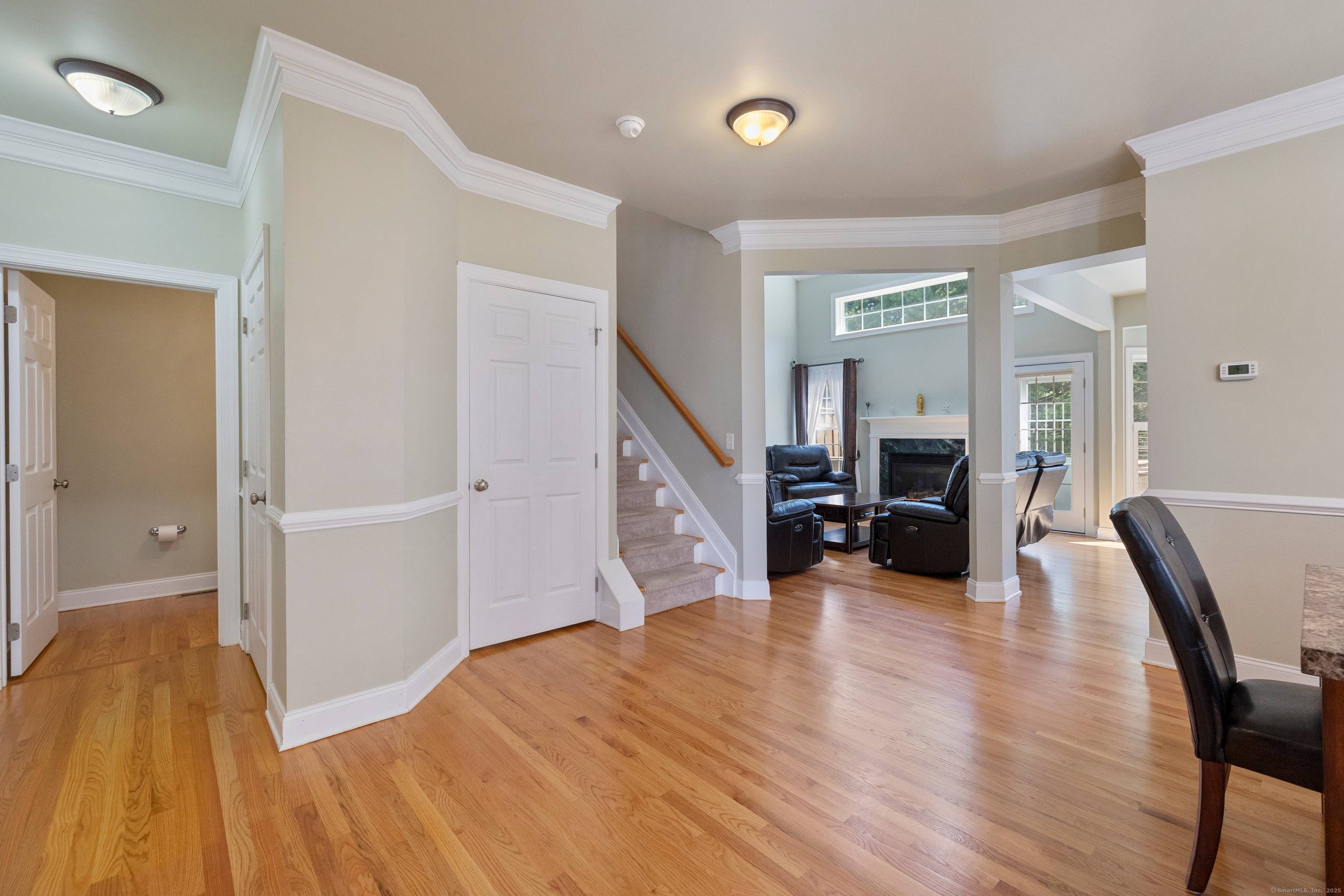Fall in love with this beautifully maintained end unit townhome in the highly sought after Newington Ridge community, built by Toll Brothers.