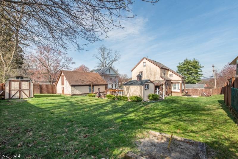 Charming Vintage Tudor esque Colonial in the heart of sought after Rockaway Borough, offering timeless character, modern functionality, and an unbeatable walkable neighborhood setting.