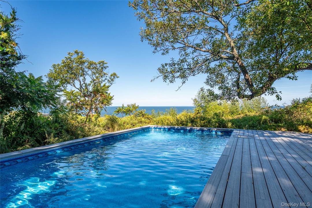 Perched on a 100 foot high bluff with commanding views of Long Island Sound, this exceptional 3 bedroom, 5 bath contemporary home is a rare fusion of design, privacy, and ...