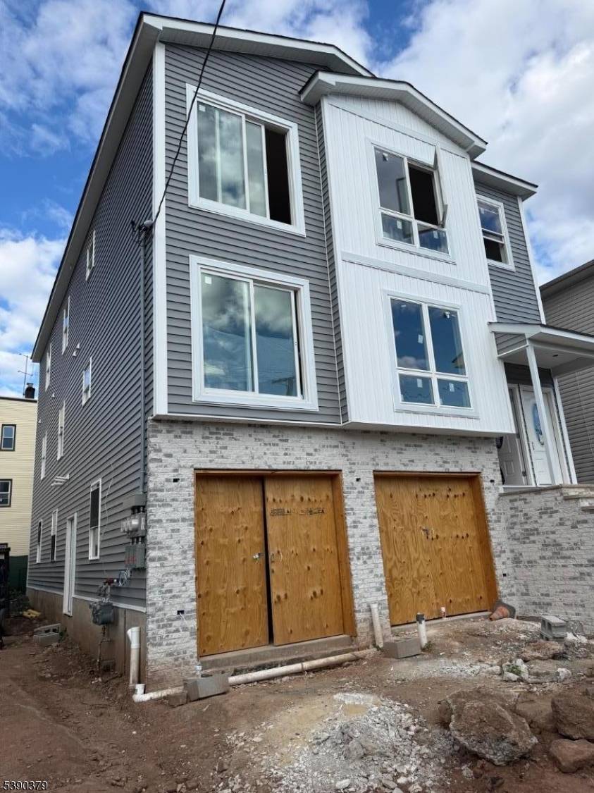 Welcome to this stunning New Construction, 2 Family Home, Offering the Perfect blend of Modern design, Comfort and Functionality the top floor features 4 spacious bedrooms and 2 full bathrooms ...