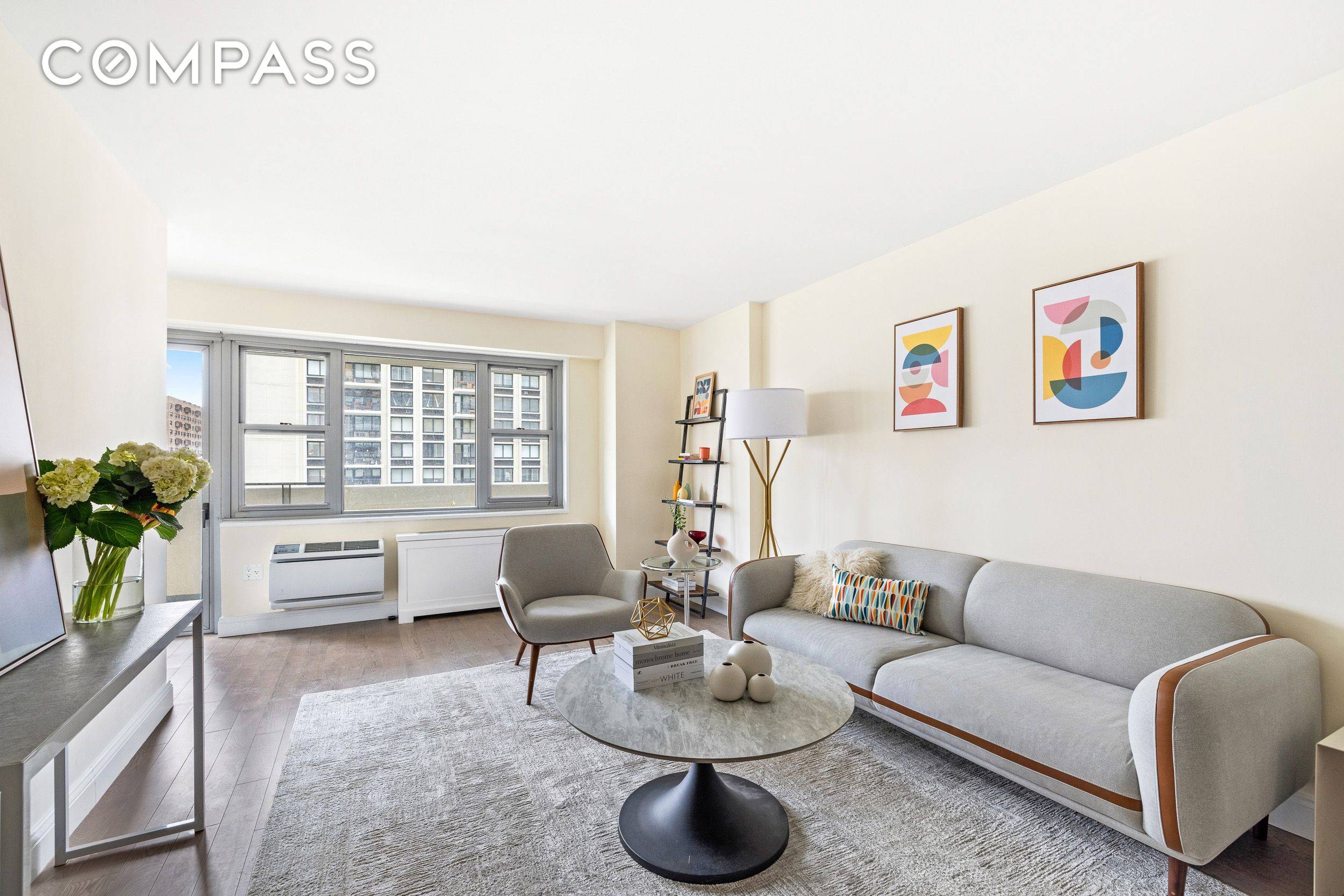 Sunlit corner 2 bedroom with oversized private balcony and open city views with just 1 block from Central Park !