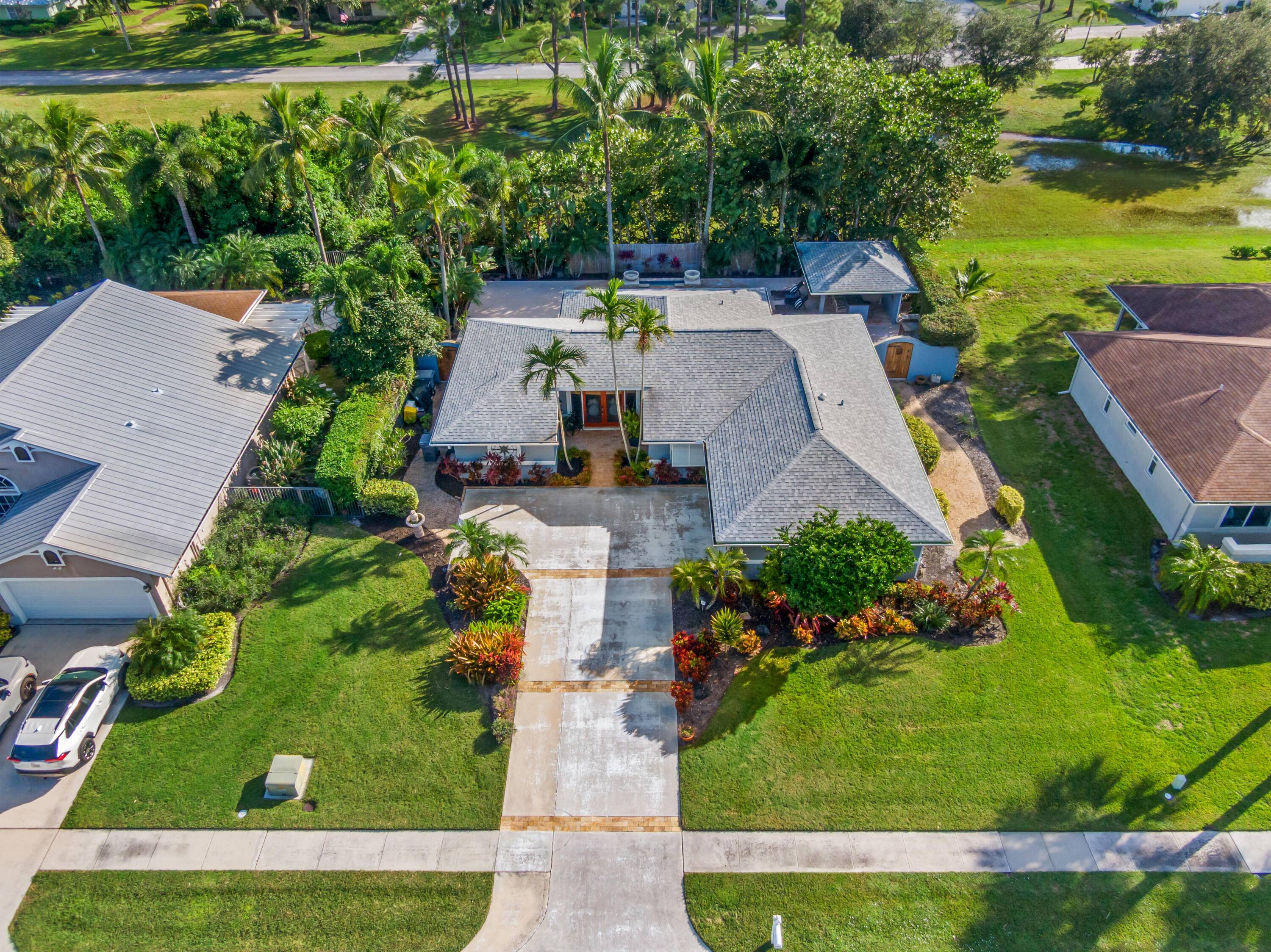 Welcome to 5936 Loxahatchee Pines Drive, a stunning CBS, 3 bedroom, 2.
