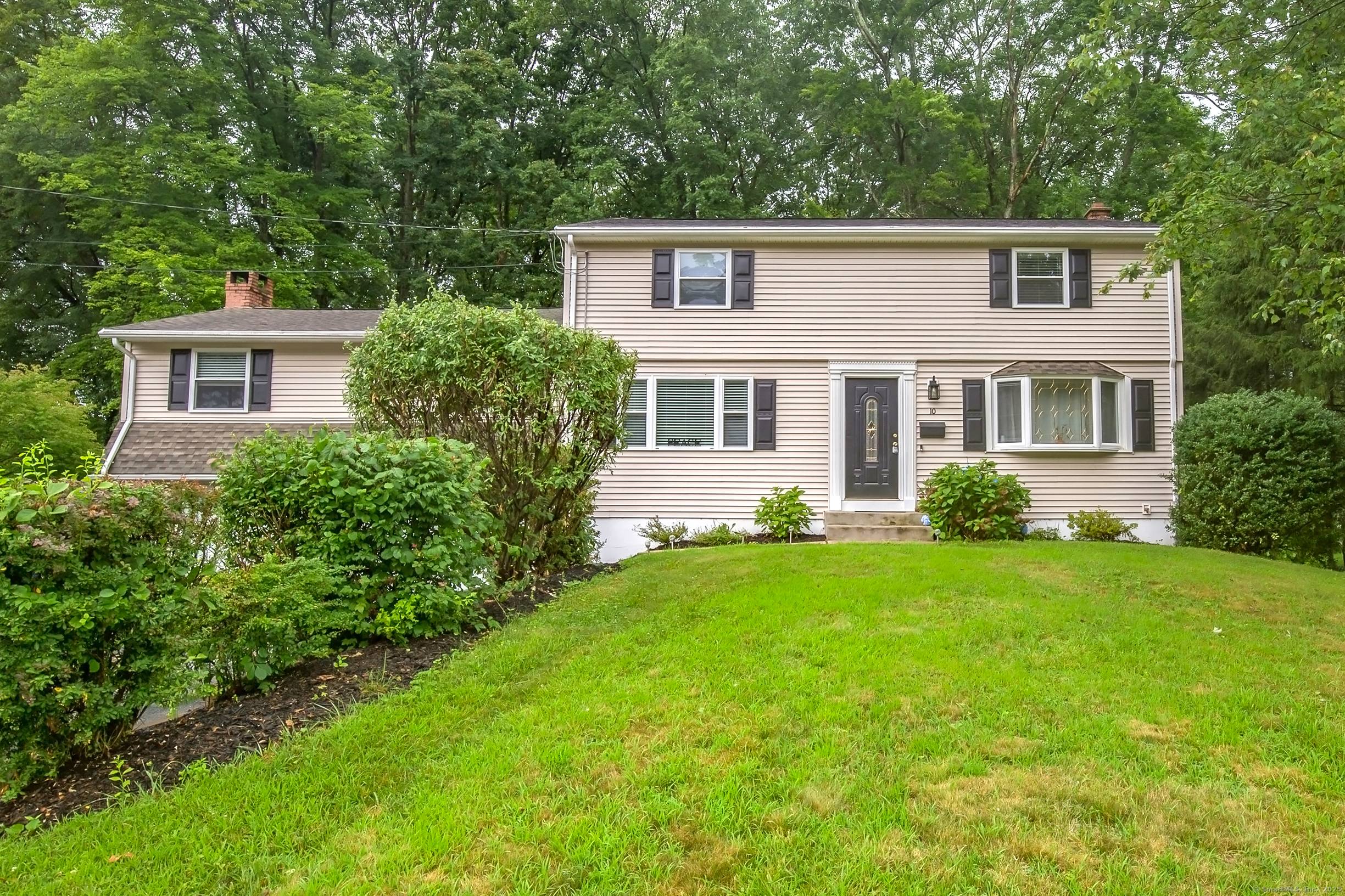 Pride of ownership shines throughout this classic center hall Colonial, ideally located in the heart of Enfield.
