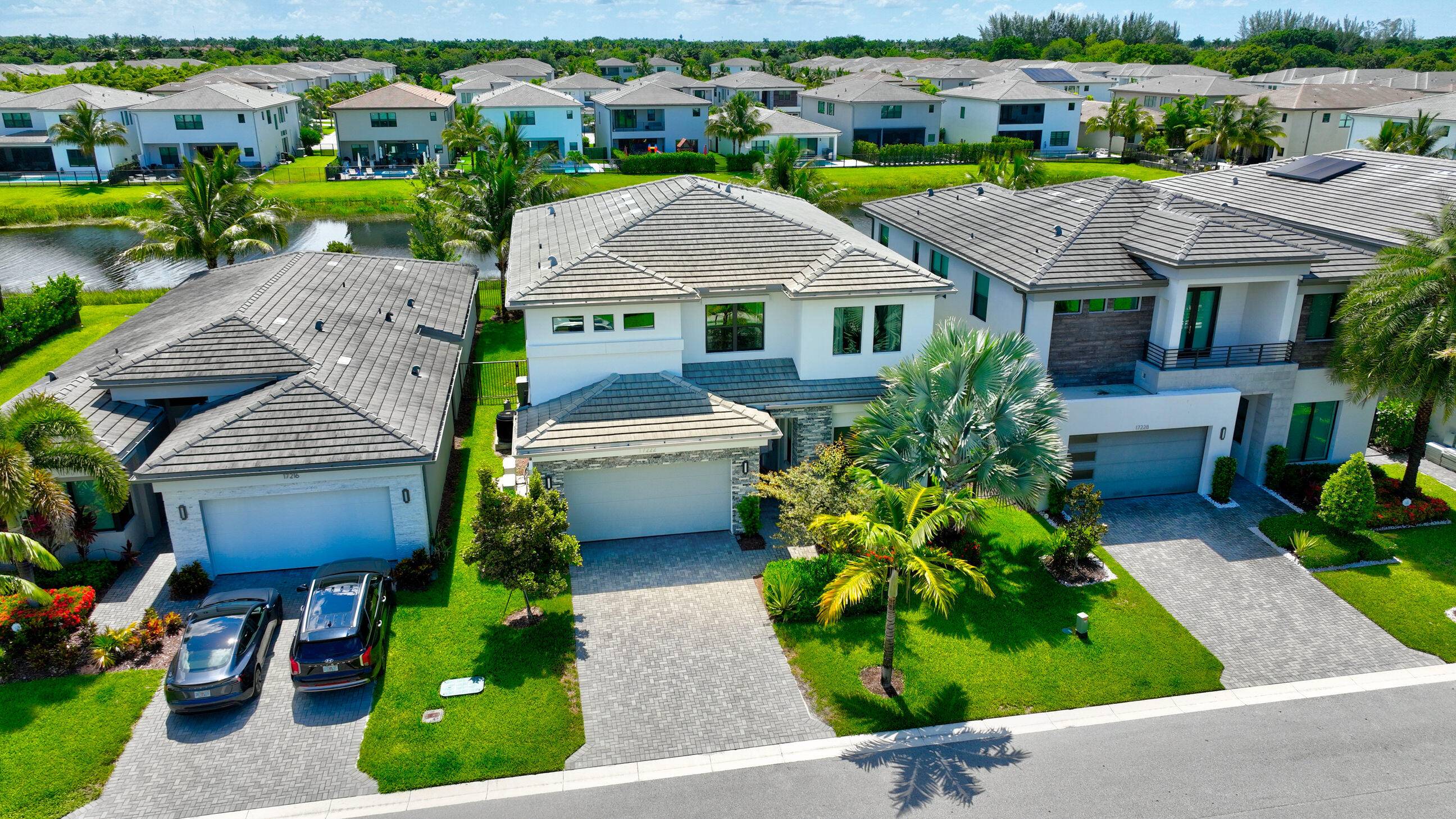 Experience upscale living in this stunning 5 bedroom, 5 bathroom lakefront residence located in the prestigious, guard gated community of Lotus, Boca Raton.