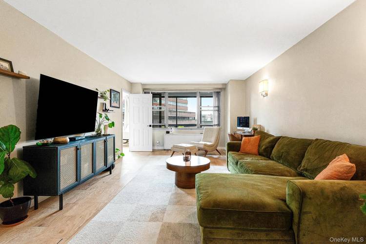Welcome to this move in ready corner 2 bedroom converted Jr 4 home with city views and terrace.