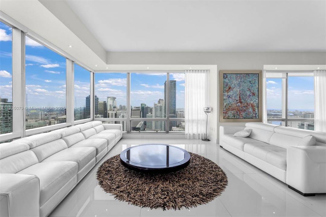 Experience stunning open bay and skyline views from this spacious corner two bedroom and two and a half bath home at The Four Seasons, a full service Brickell building close ...