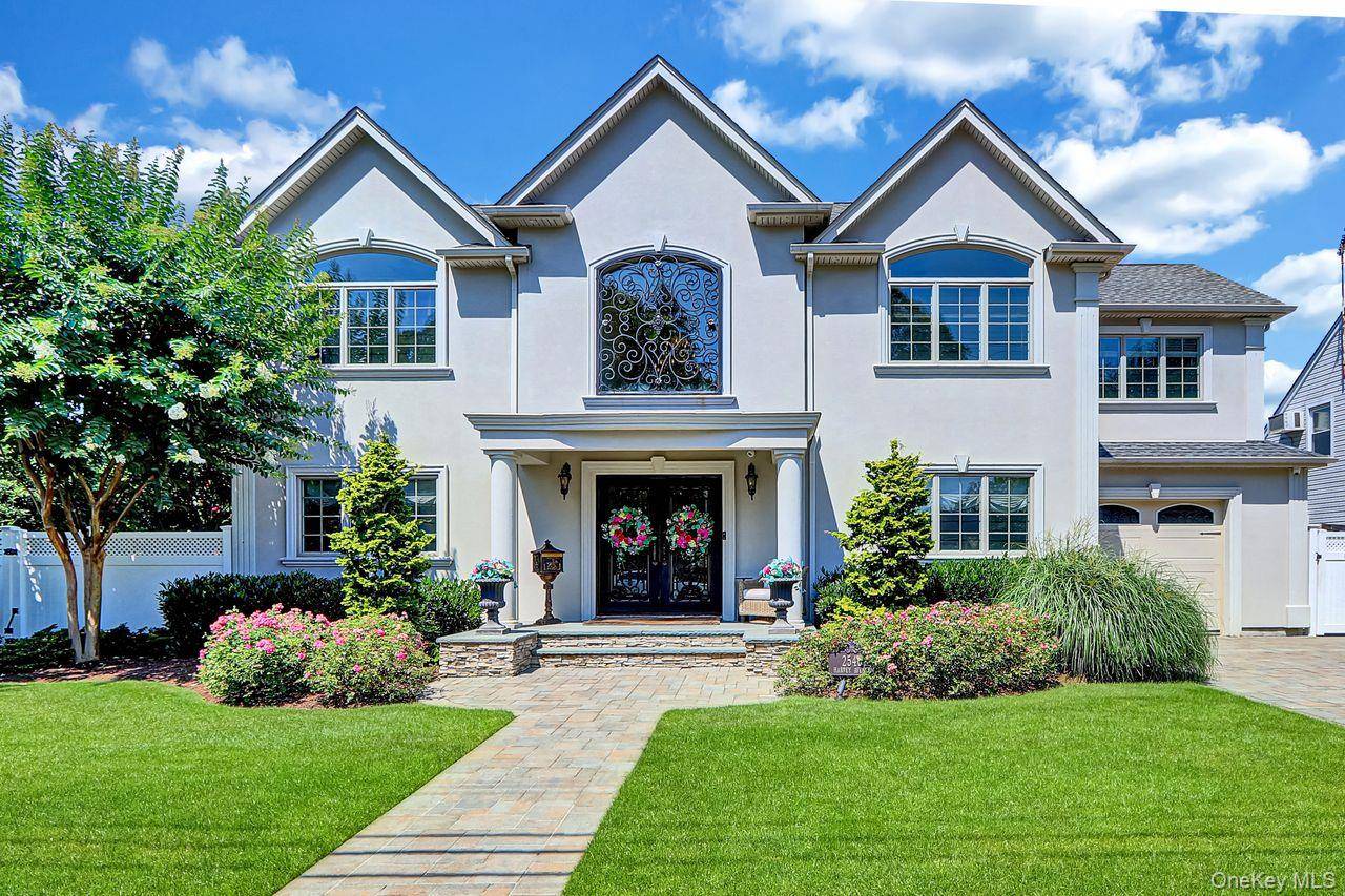 This one of a kind impressive custom built in 2015 center hall colonial features the best construction and finishes available.