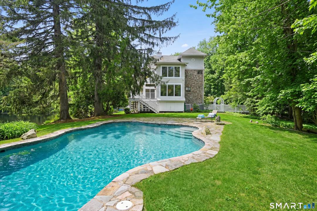 Completely rebuilt from the studs in 2008, this one of a kind Contemporary blends sleek modern design with classic New England exterior charm.