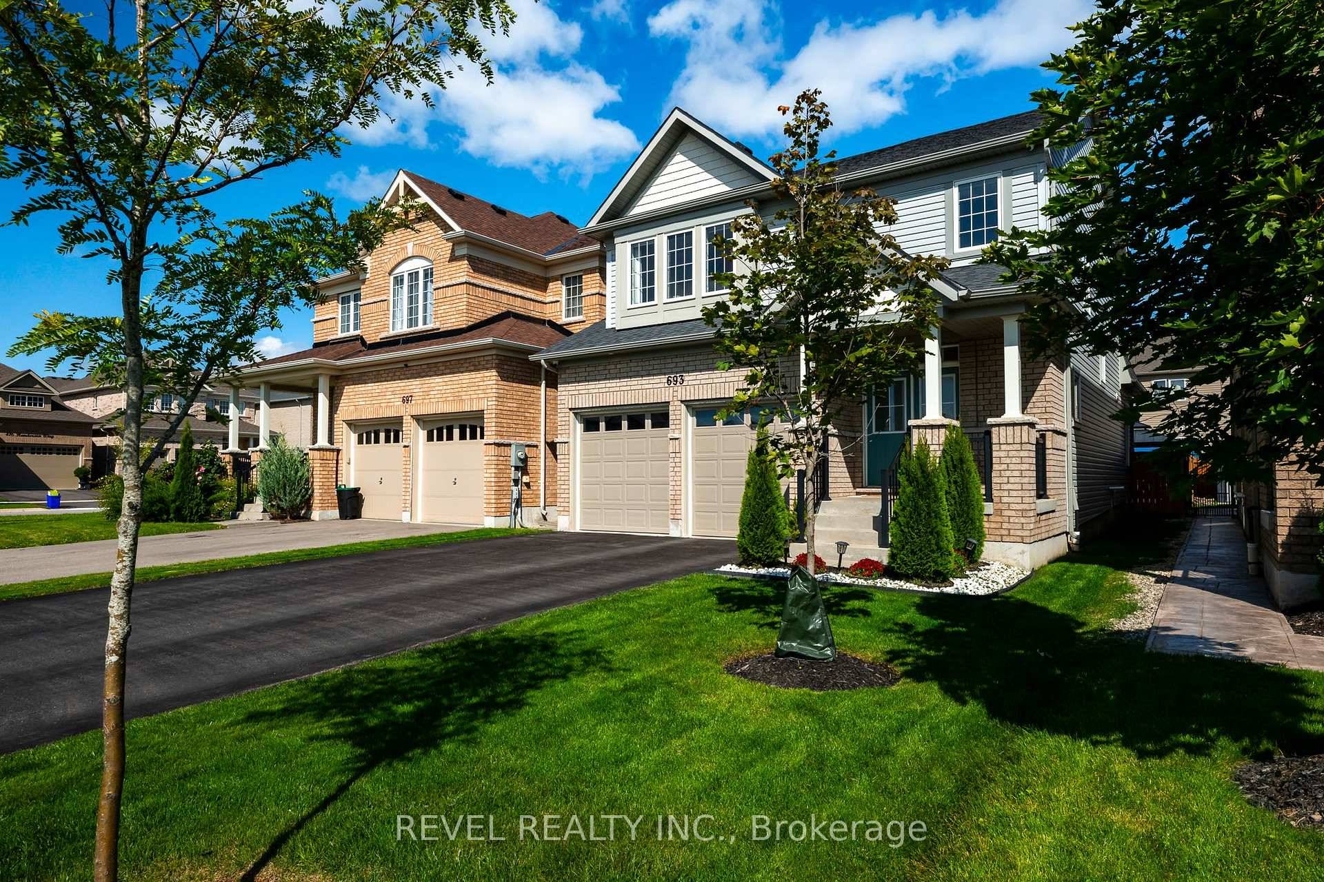 Welcome to 693 McMullen Drive where modern design meets small town charm in Shelburne's desirable Hyland Village.