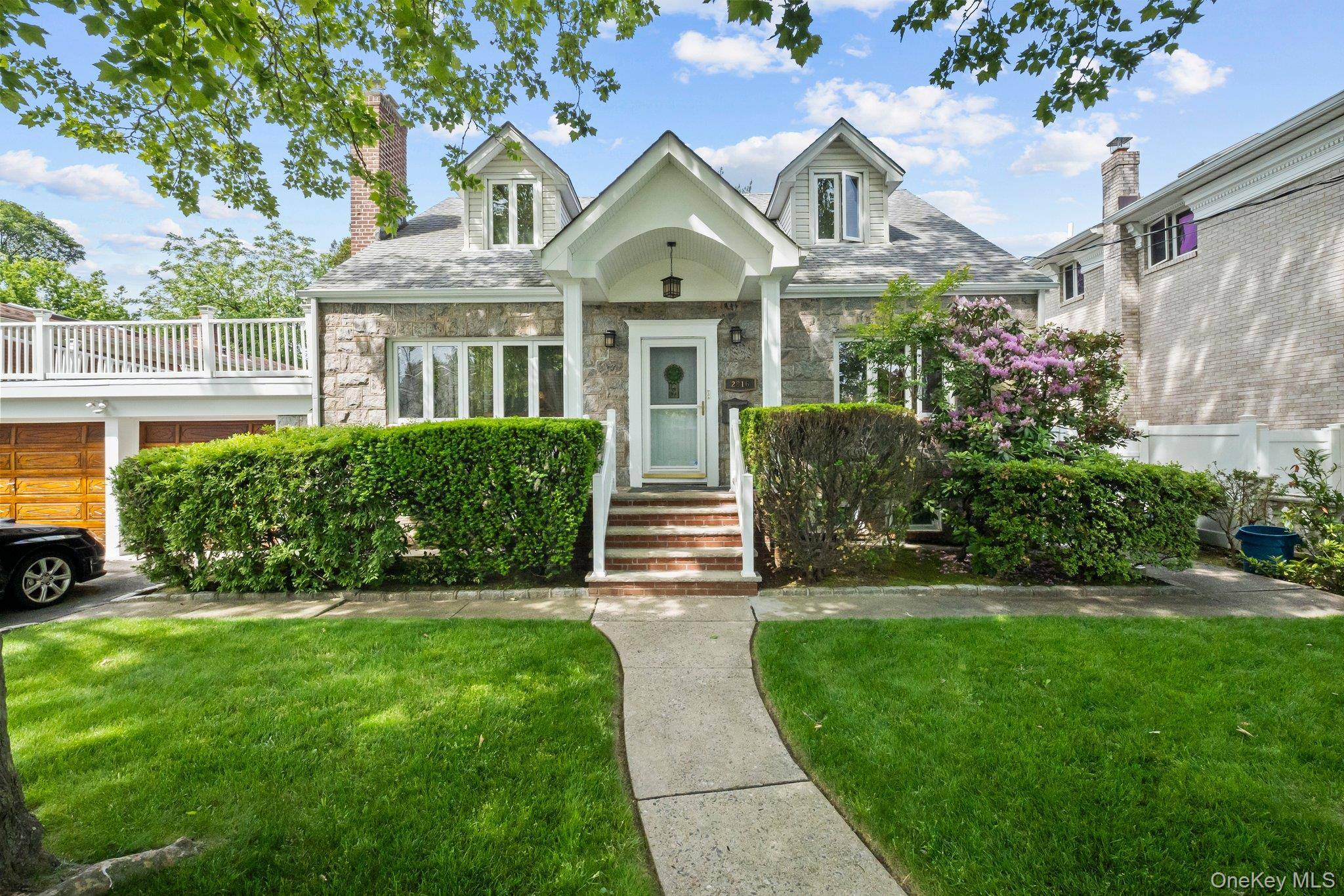 Expanded Cape on Oversized Lot Near Bayside Gables Two Family Zoned.