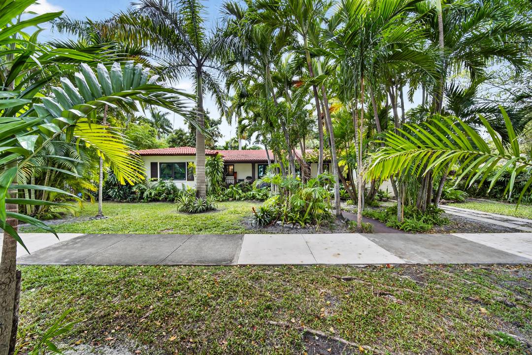 Set on an expansive 10, 400 square foot lot in one of Coral Gables' most coveted locations, this private 3 bedroom, 2.