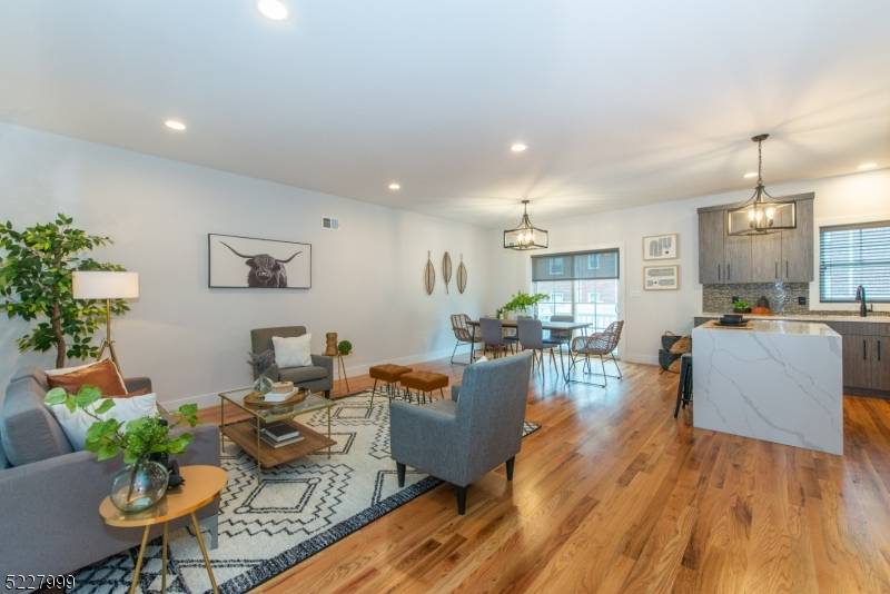 Experience the perfect fusion of modern design and effortless convenience in this recently built townhome, set on a private, oversized lot yet moments from Montclair's vibrant scene.