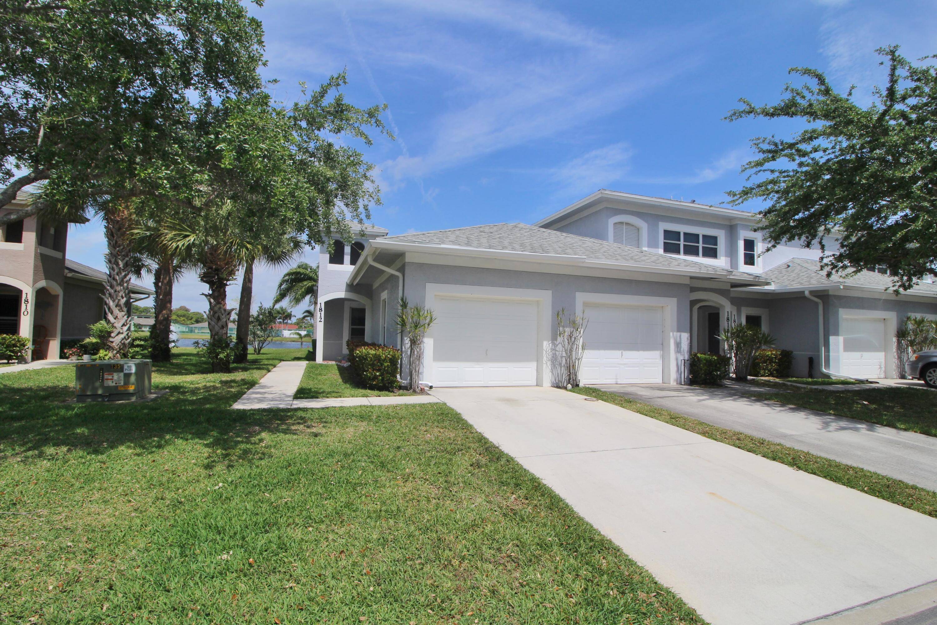 This first floor corner unit offers one of the best lake views in The Lakes At The Savannahs.