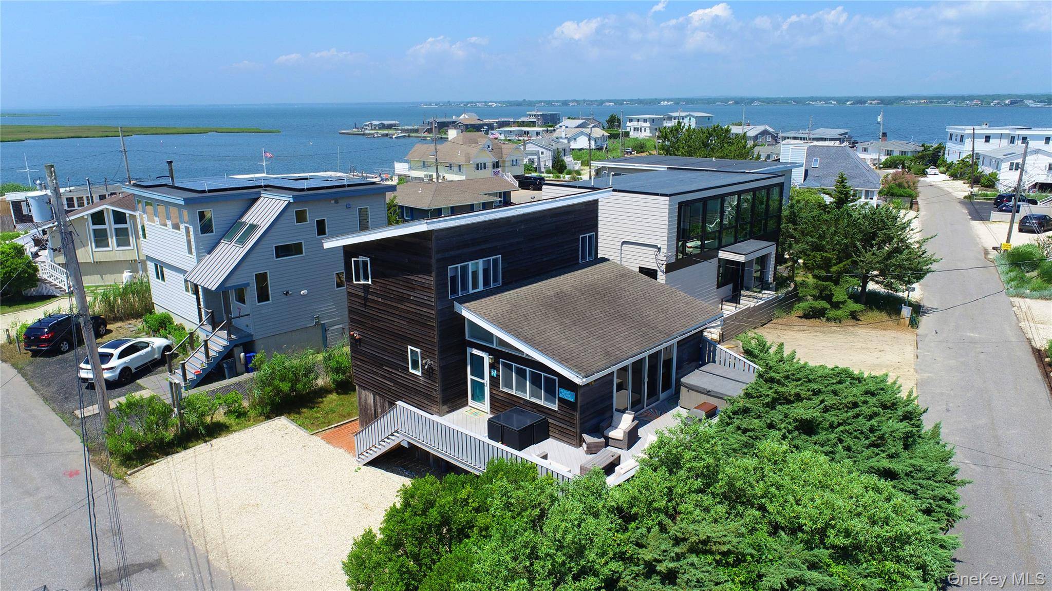 Nestled in one of the most sought after communities on Dune Road, this beloved beach home exudes classic seaside charm.