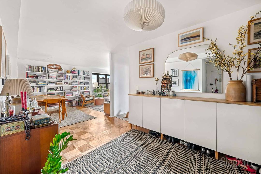 High floor 2 bedroom with southwest facing windows into the expansive living room, setting a warm and inviting tone throughout this beautifully updated home.