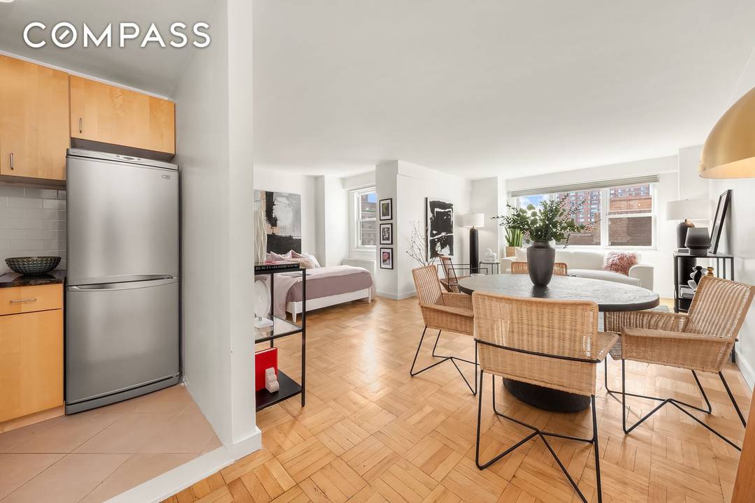 Welcome home to this sun drenched, loft like alcove studio in a white glove doorman building in the heart of The Village.