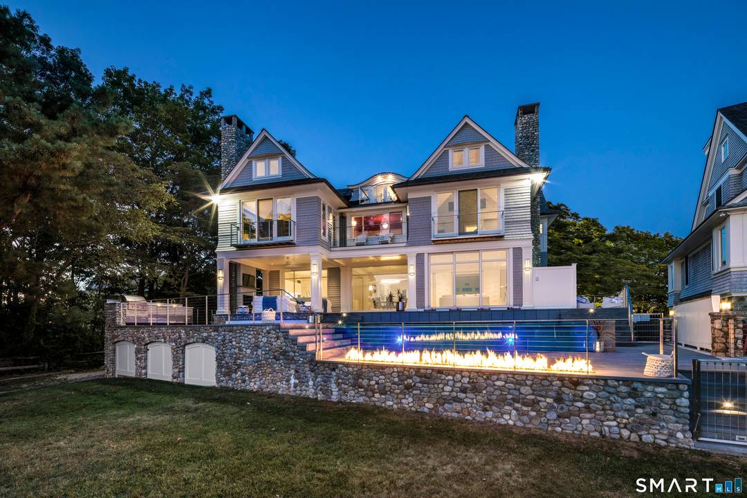 Set prominently along the coveted shoreline of Rowayton, this extraordinary residence is a true architectural masterpiece that defies the standard coastal trope.