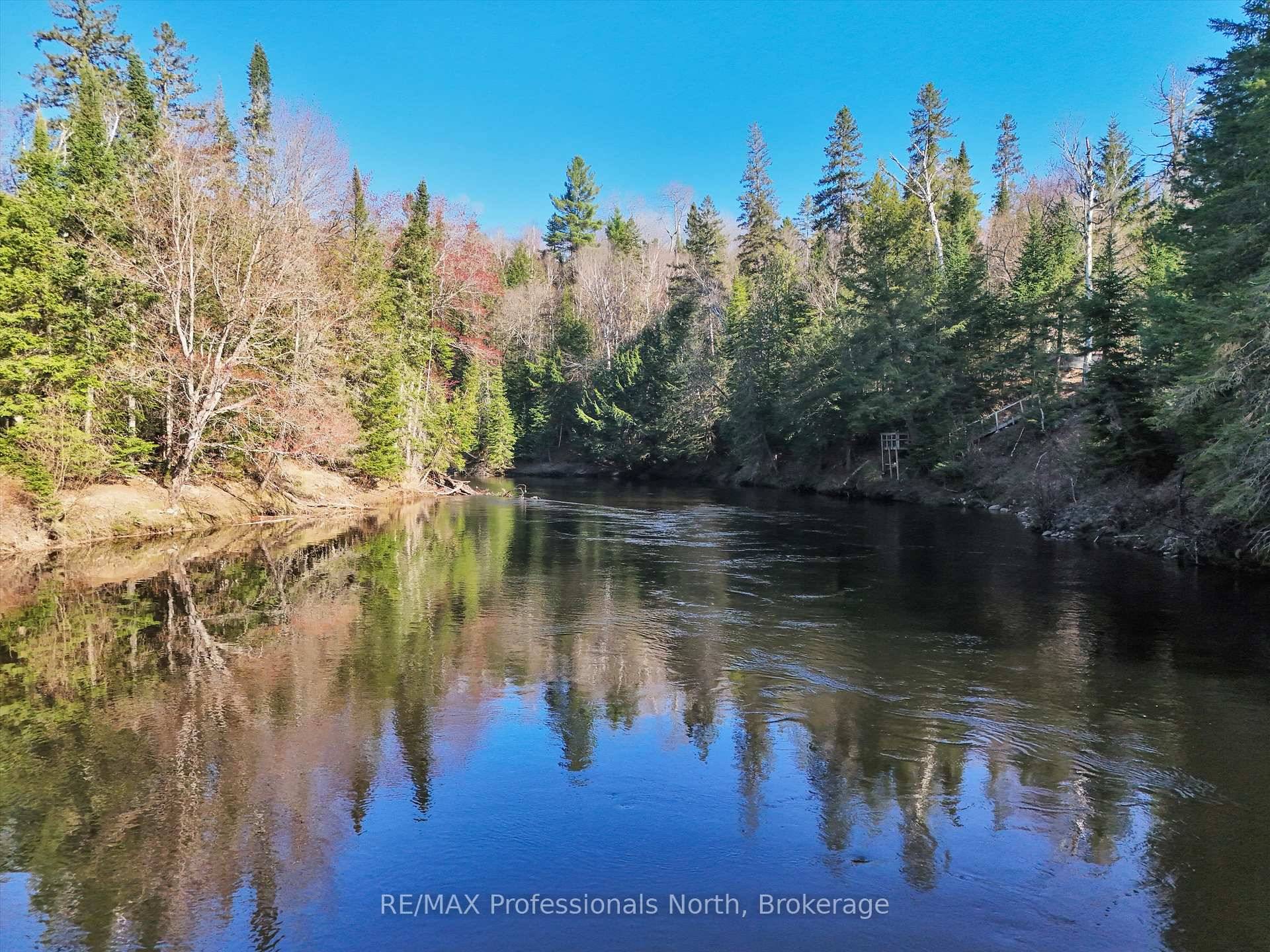 Offering cottage or year round home nestled along over 1800 feet of pristine shoreline on the Big East River.