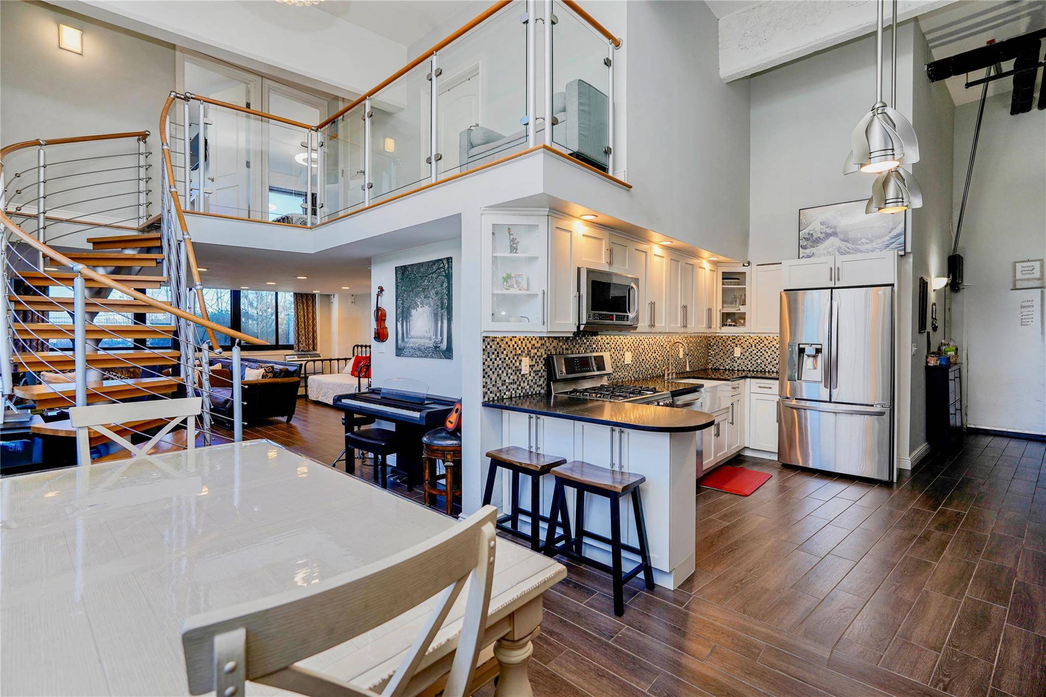 Walk in and take in soaring 14 ceilings and windows !