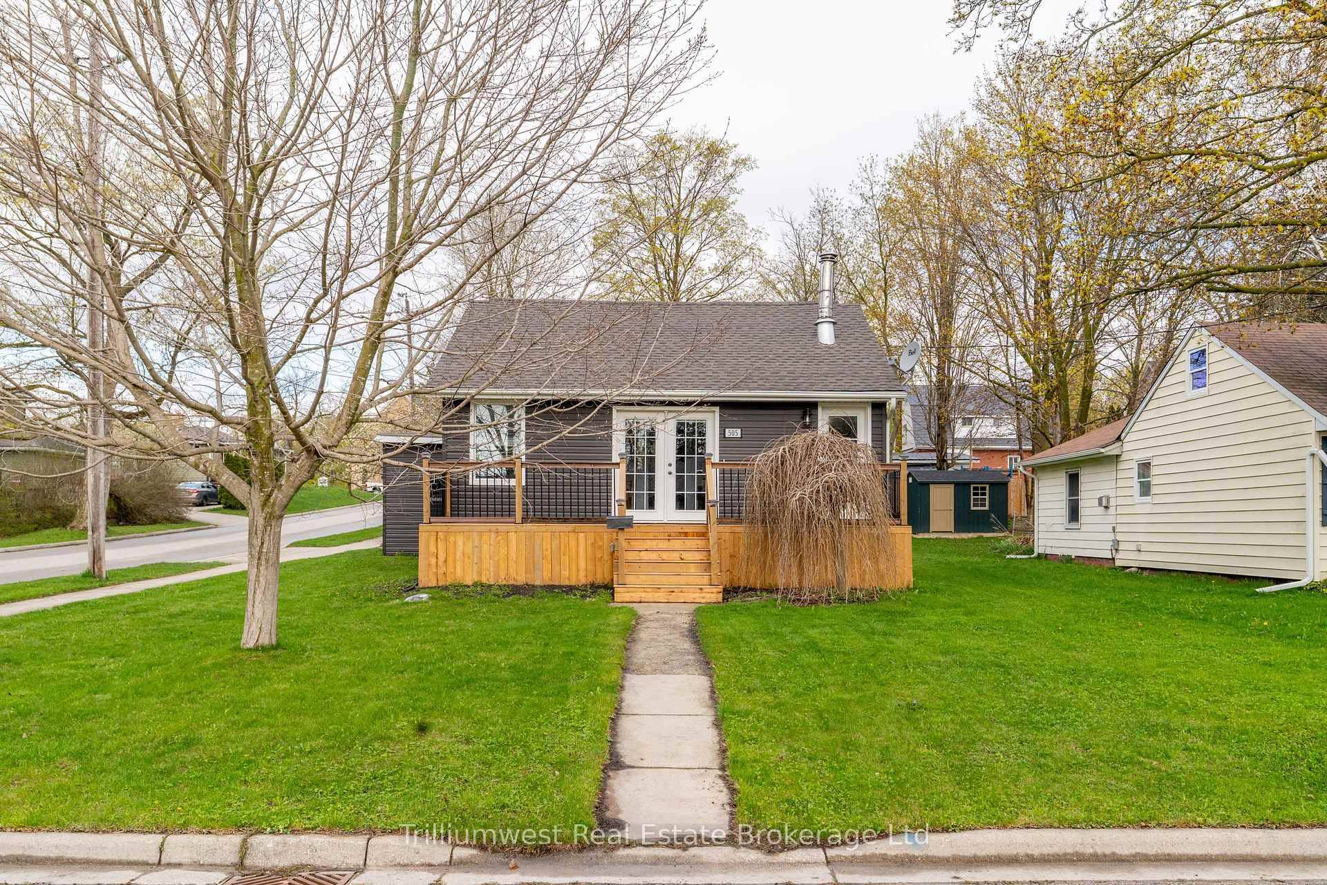 Tucked beneath the shade of mature trees on a peaceful corner lot, 505 York Ave.
