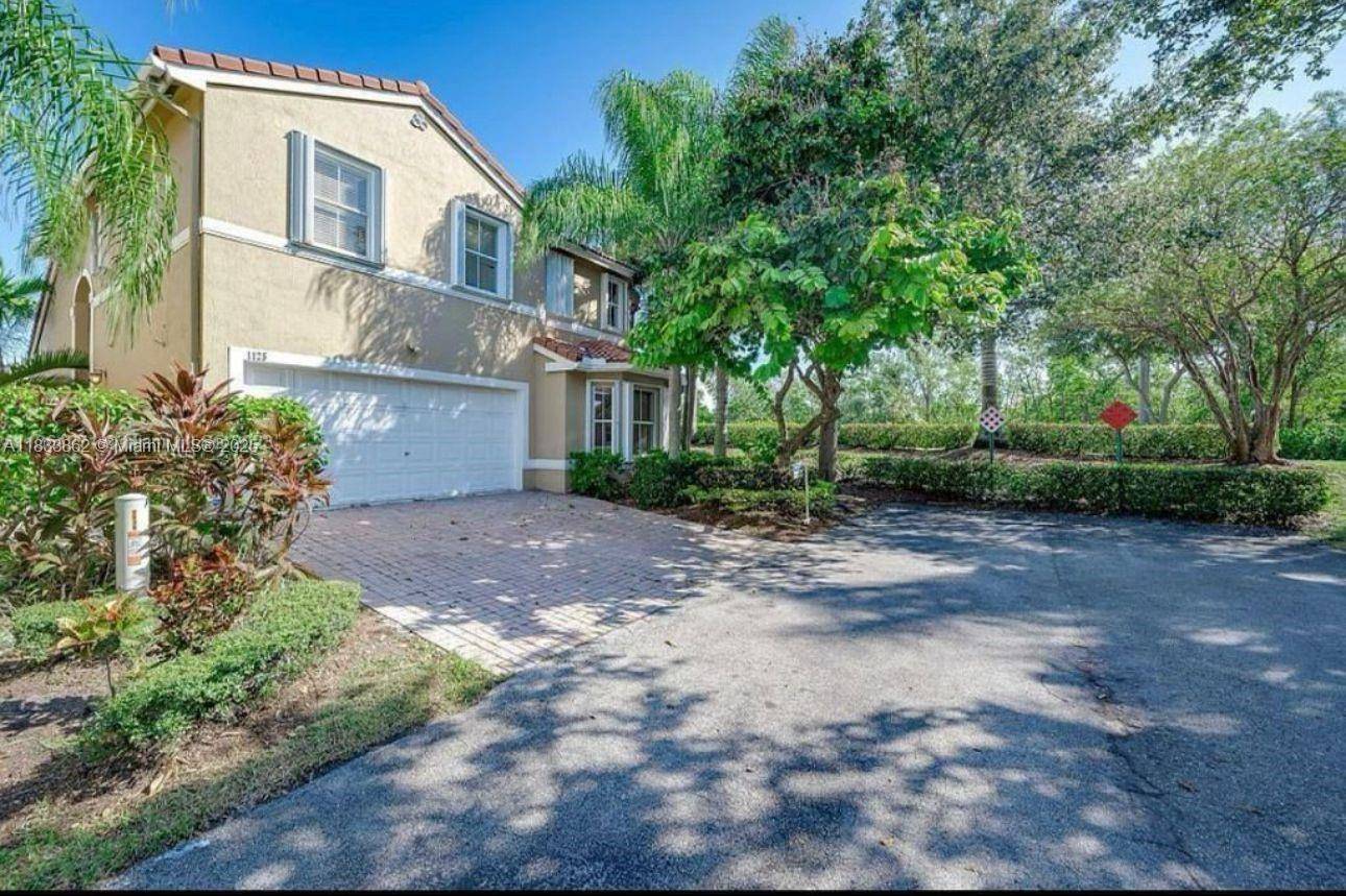 Located on a desirable corner lot with canal access, this well maintained home offers privacy and curb appeal.
