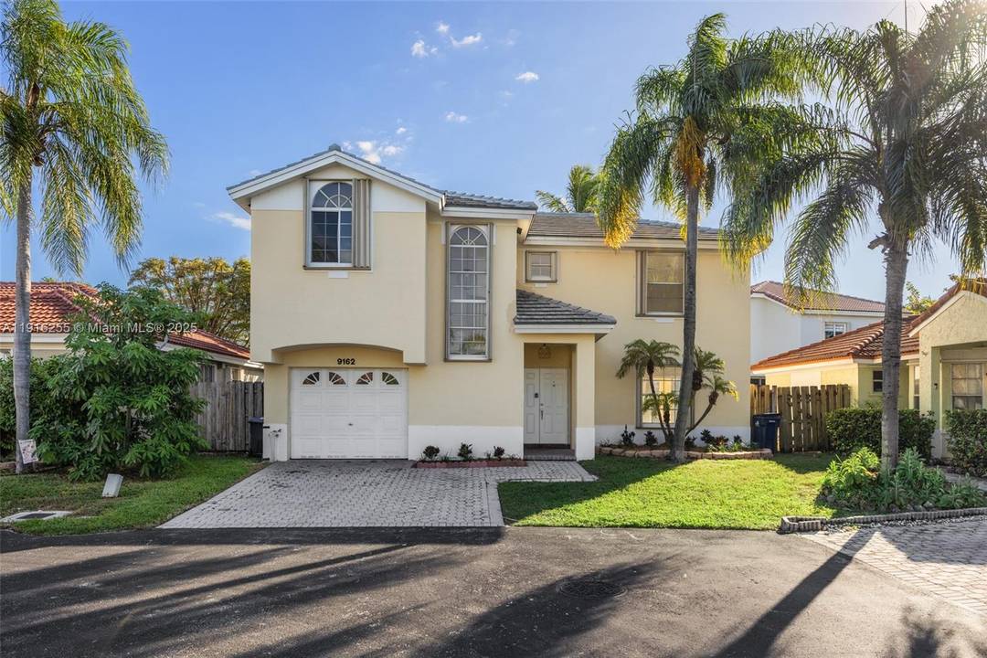 Enjoy serene lake views and radiant sunsets from this beautifully maintained two story home in Cutler Bay.