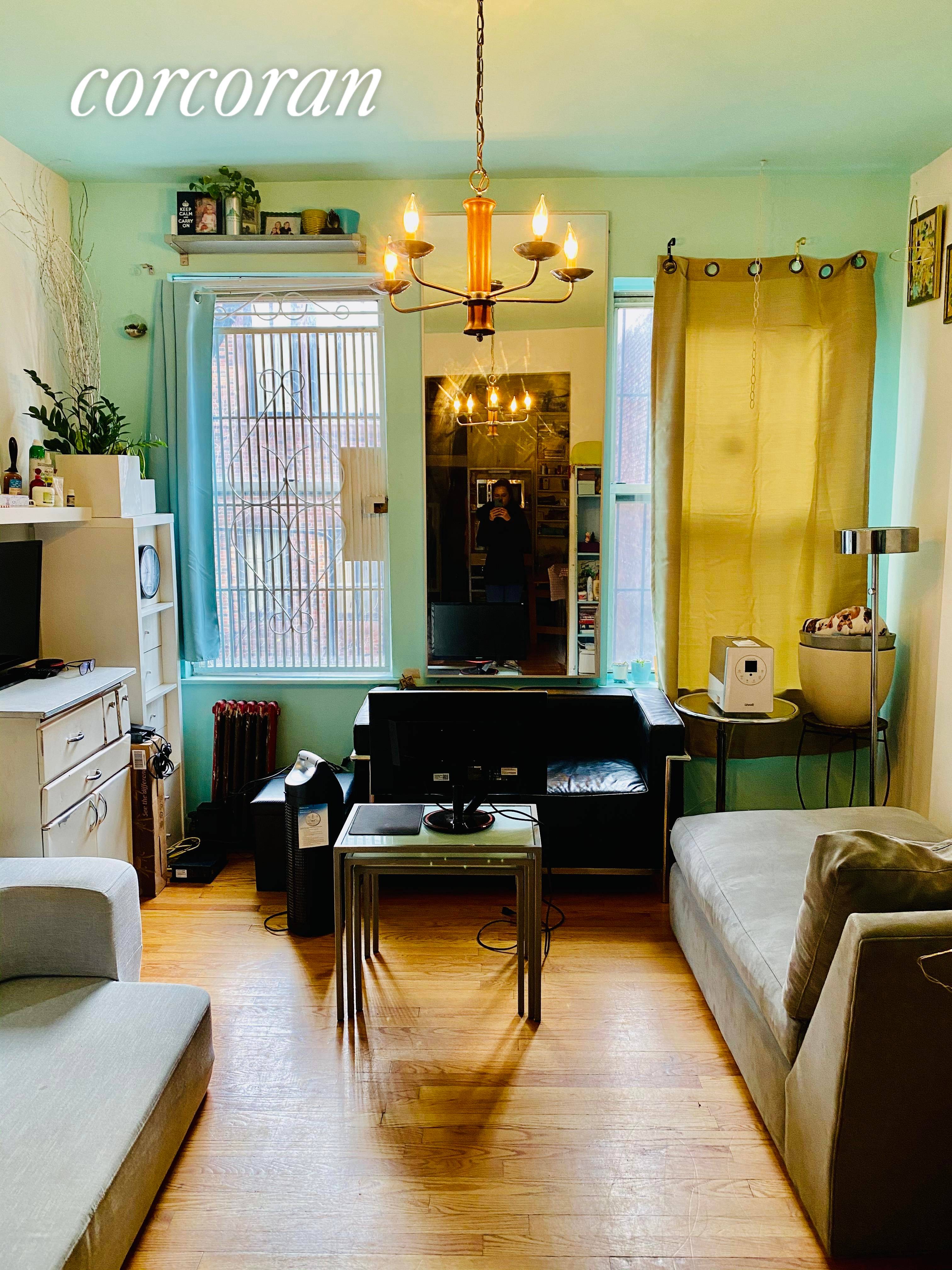 Spacious rent stabilized one bedroom apartment with hardwood floors and open kitchen layout.