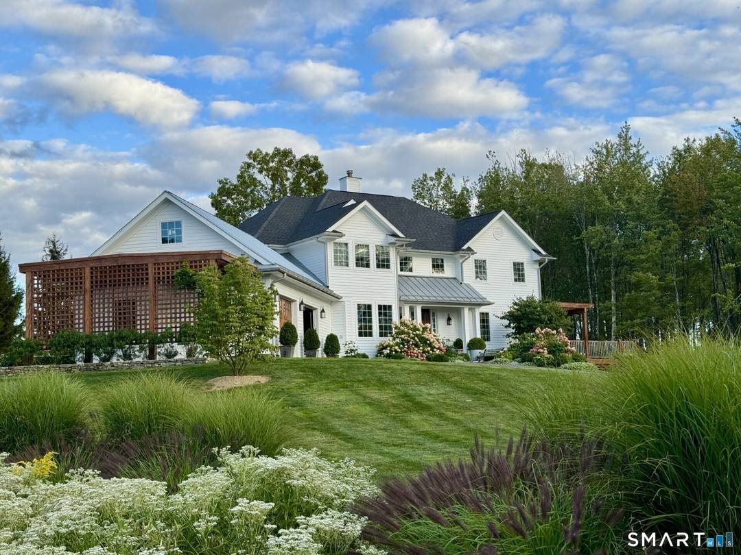 Perched atop Painter Hill Roxbury's highest elevation and one of its most coveted addresses this newly renovated residence offers breathtaking, year round Sunrise and Sunset views.
