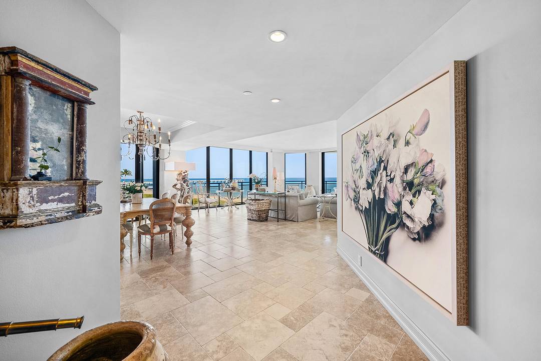 Experience coastal living at its finest in this meticulously maintained corner residence at the Palm Beach Hampton.