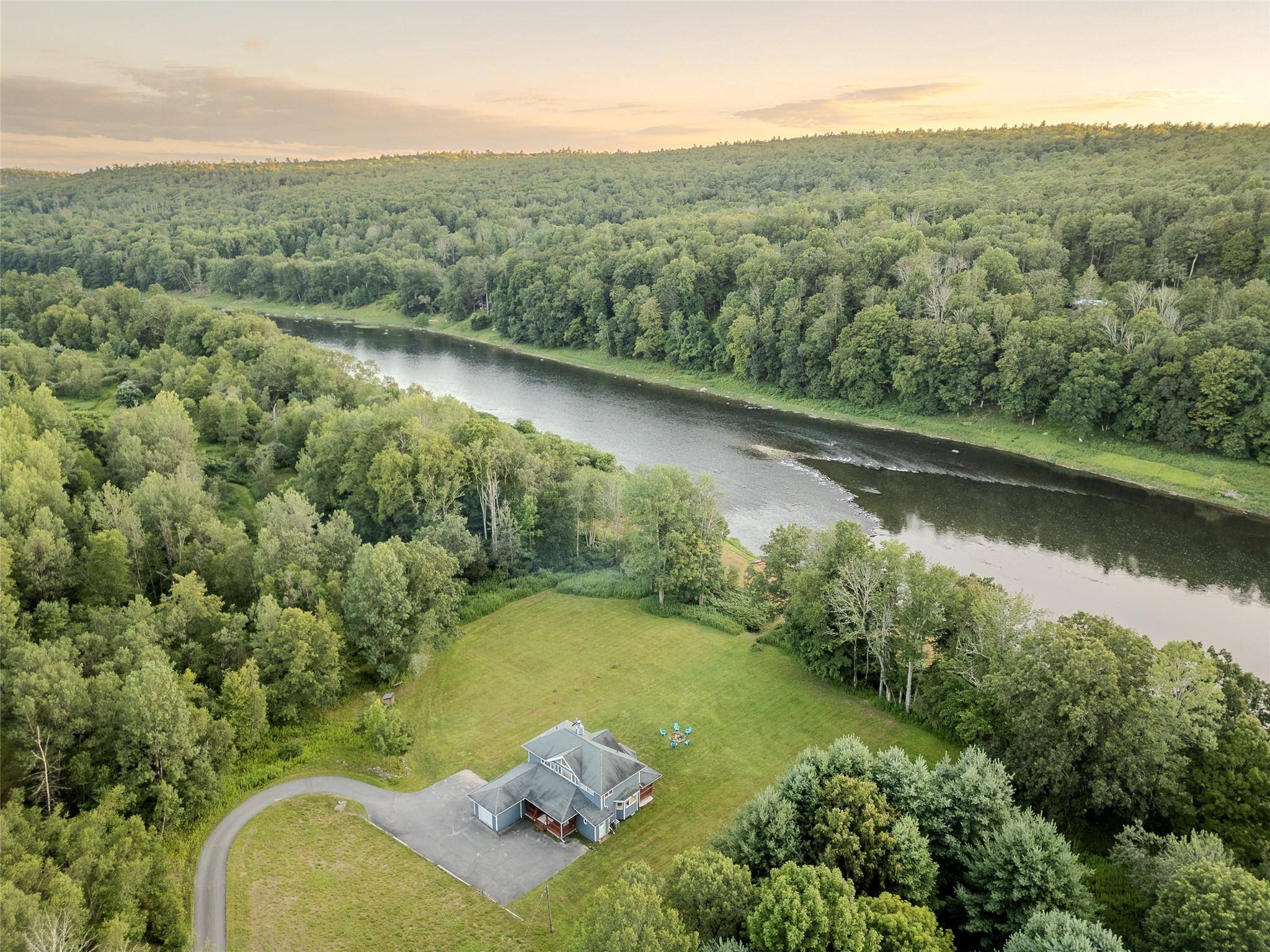 The Overlook on Arrowhead a serene contemporary retreat perched above the Delaware River, where modern sophistication meets Catskills tranquility.